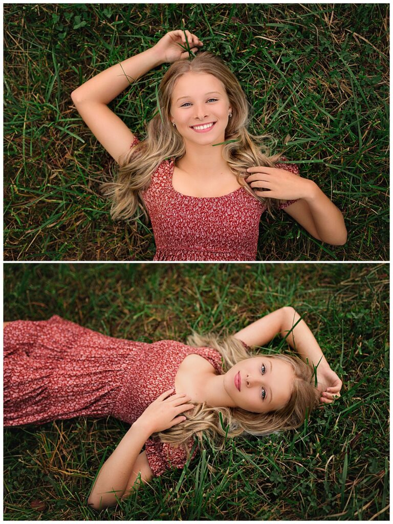 high school student lays in grass smiling with hand above her head by Charlottesville luxury photographer